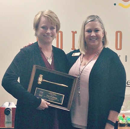 Past President Tina Workman accepting award from New President, Suzanne Rothwell